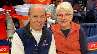 Kip Acheson and Elizabeth Carr at a UVA basketball game