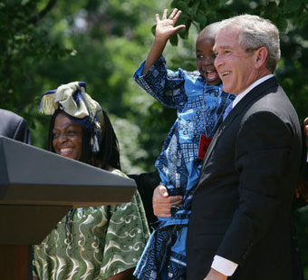 George W. Bush holding child