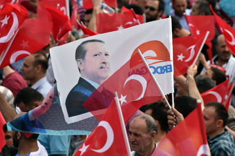 Crowd of people waving Turkish flag
