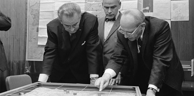 Lyndon Johnson looks a map of Khe Sanh