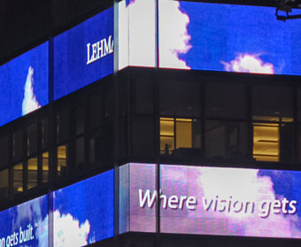 office building with LED screens wrapping every other floor