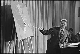 Robert McNamara pointing at map