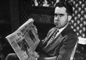 Congressman Richard Nixon with newspaper
