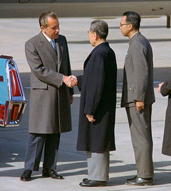 Richard Nixon shaking hands with Zhou Enlai on tarmac