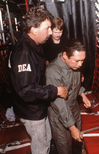 Manuel Noriega in the custody of a DEA agent