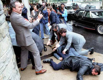 Just after the assassination attempt on US President Ronald Reagan, 30 March 1981, outside the Washington Hilton Hotel. James Brady and police officer Thomas Delahanty lie wounded on the ground.