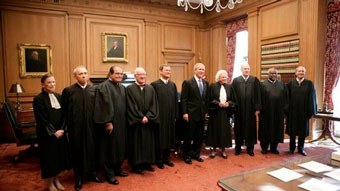 Bush poses with the Supreme Court justices in October 2005