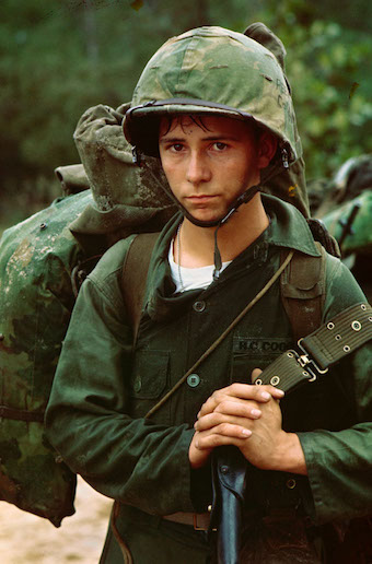 marine private waits on the beach in Da Nang, Vietnam