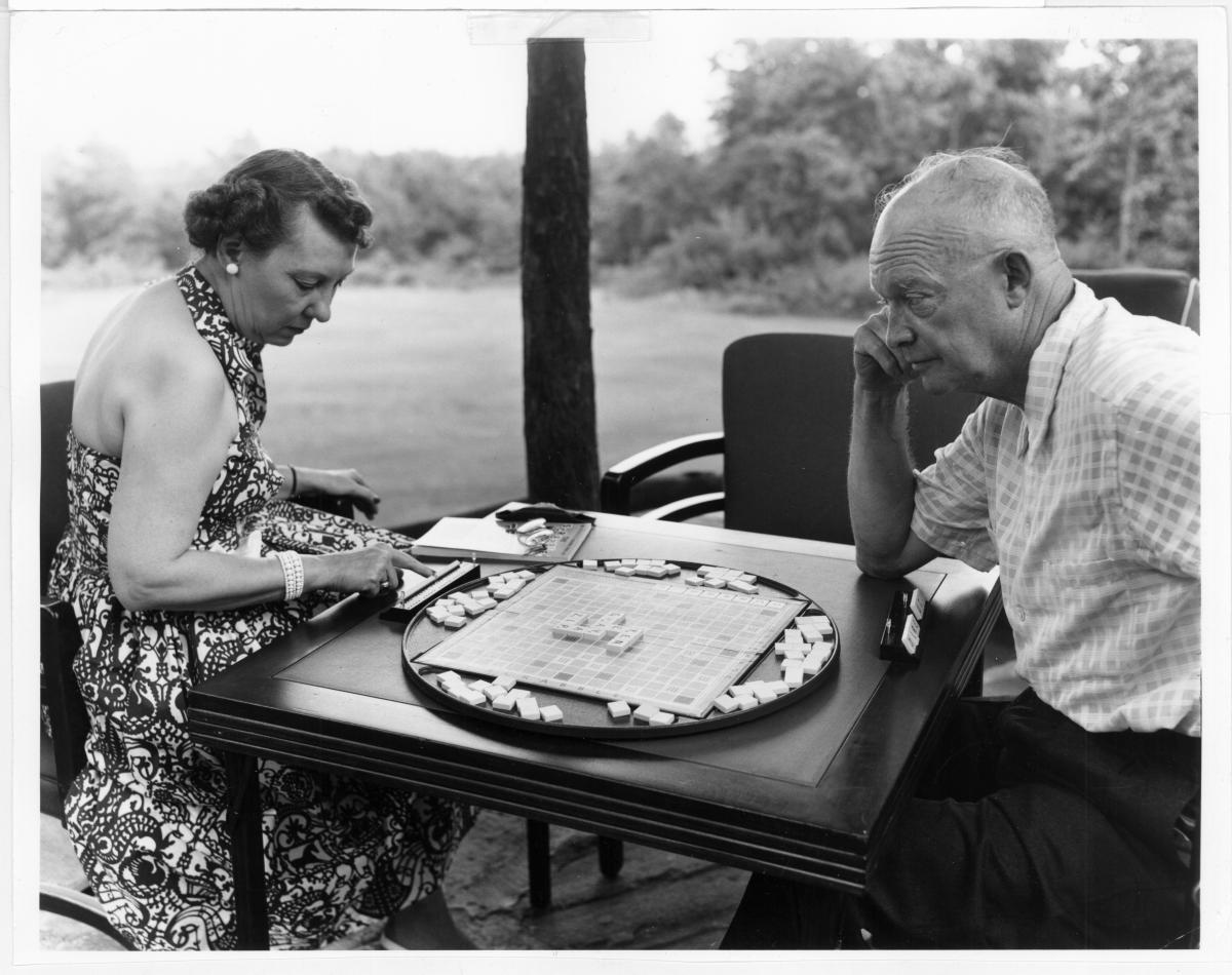 Dwight and Mamie Eisenhower play a board game together