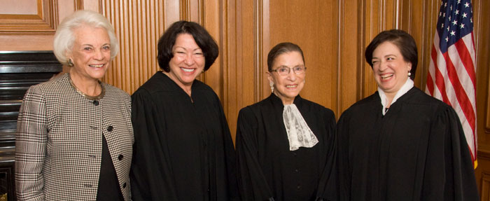 Four female justices standing