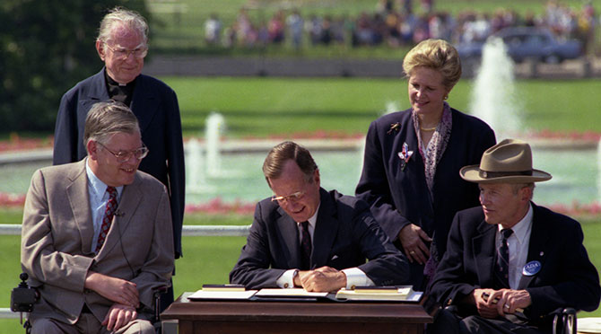 George H. W. Bush signing a bill