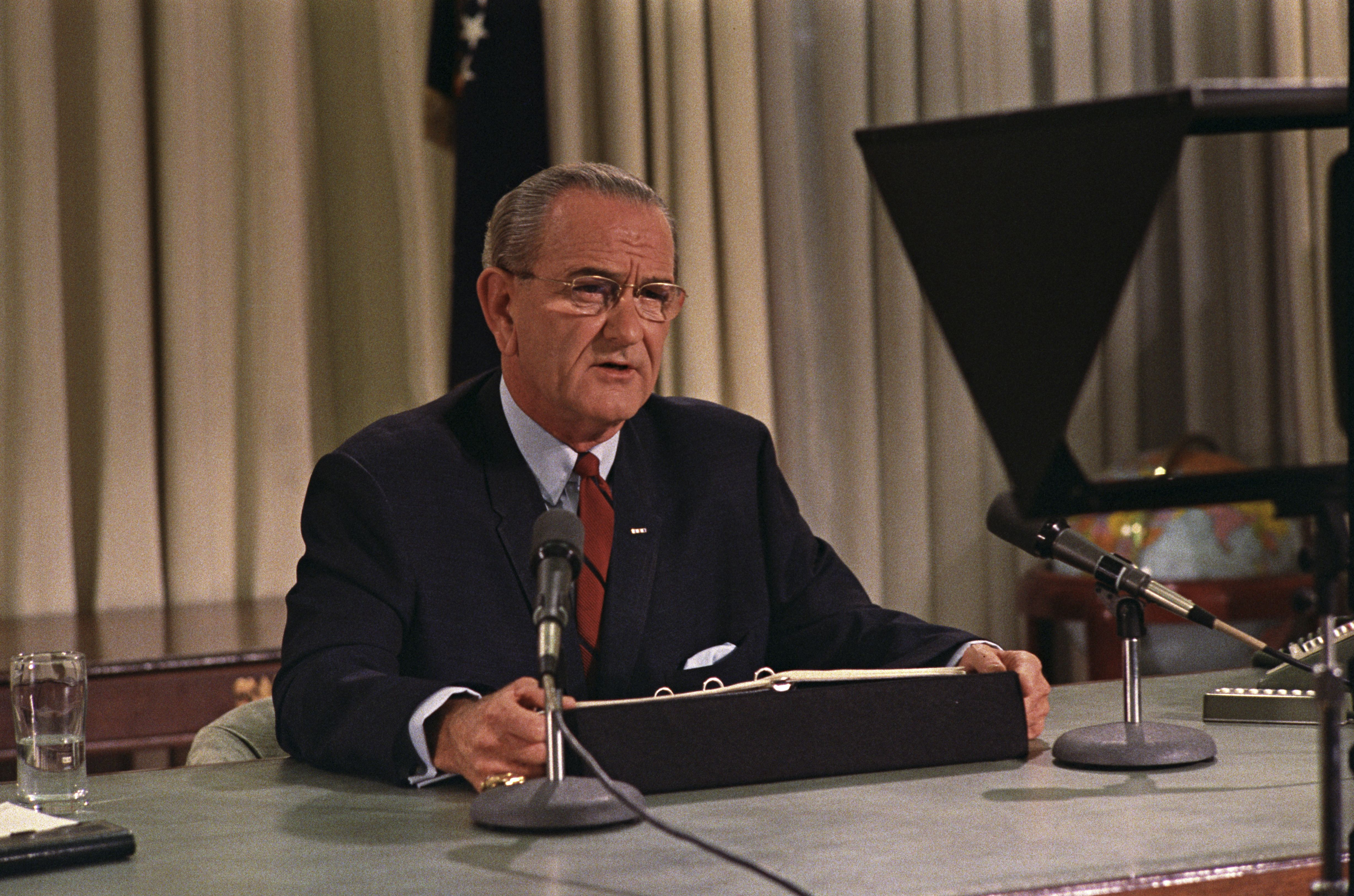 Lyndon B. Johnson speaks to nation on TV on March 31, 1968, announcing a bombing halt in Vietnam and his intention not to run for re-election.