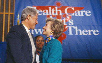 Clintons with healthcare sign
