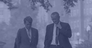 President Lyndon Johnson walking outside with Robert Kennedy