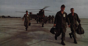 Members of a U.S. Army Division disembark from a helicopter during their withdrawal from Vietnam.