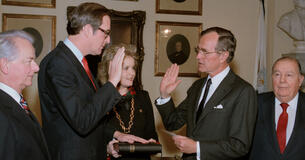 Robert Byrd standing by as Jay Rockefeller is sworn in by President George H.W. Bush