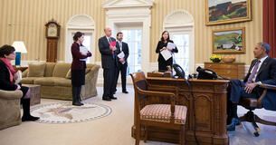 President Obama with advisors in the Oval Office