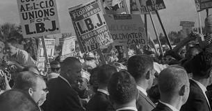 LBJ campaigning in a crowd of people