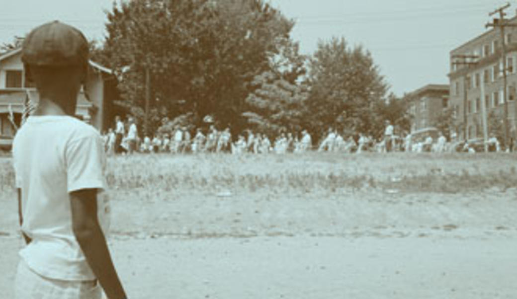 African American child watches anti-integration protestors