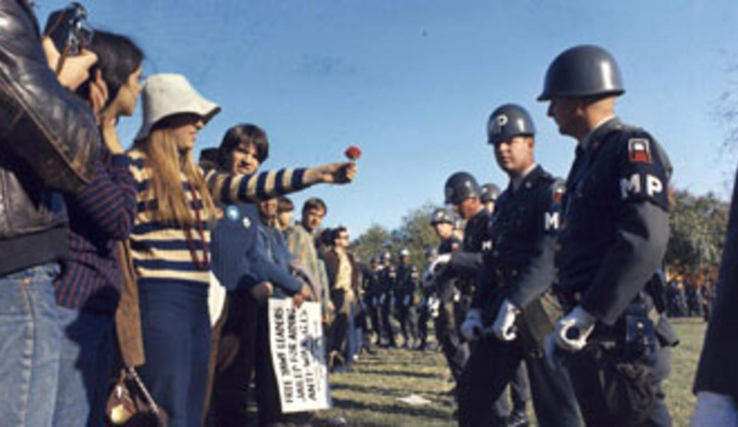 Vietnam protestor with flower