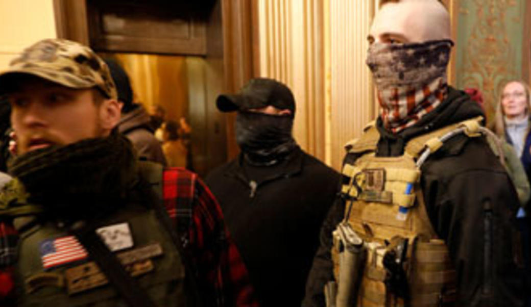 Masked men in military garb