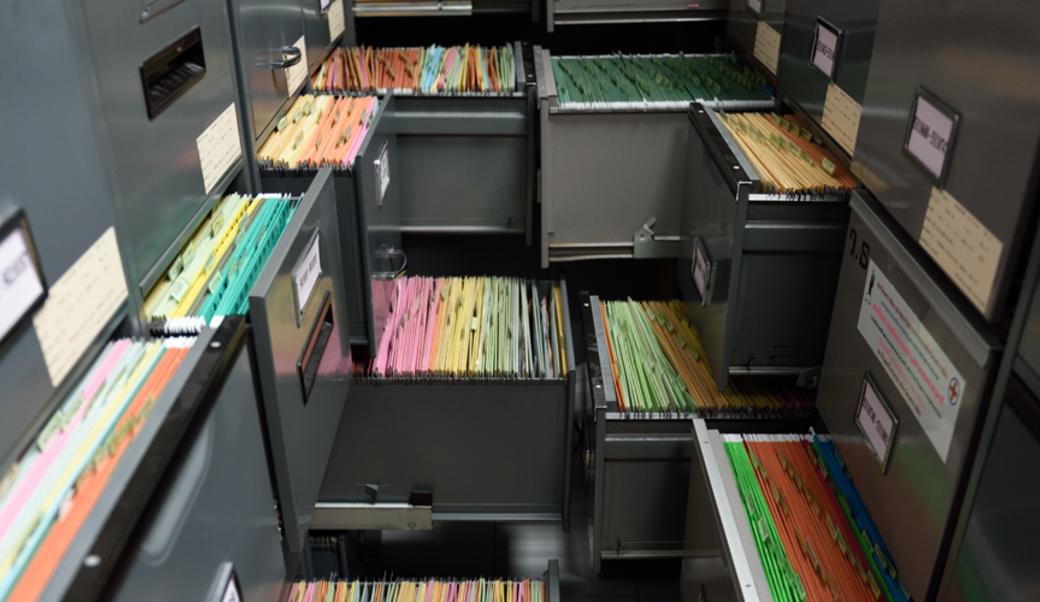 open filing cabinets showing colored file folders
