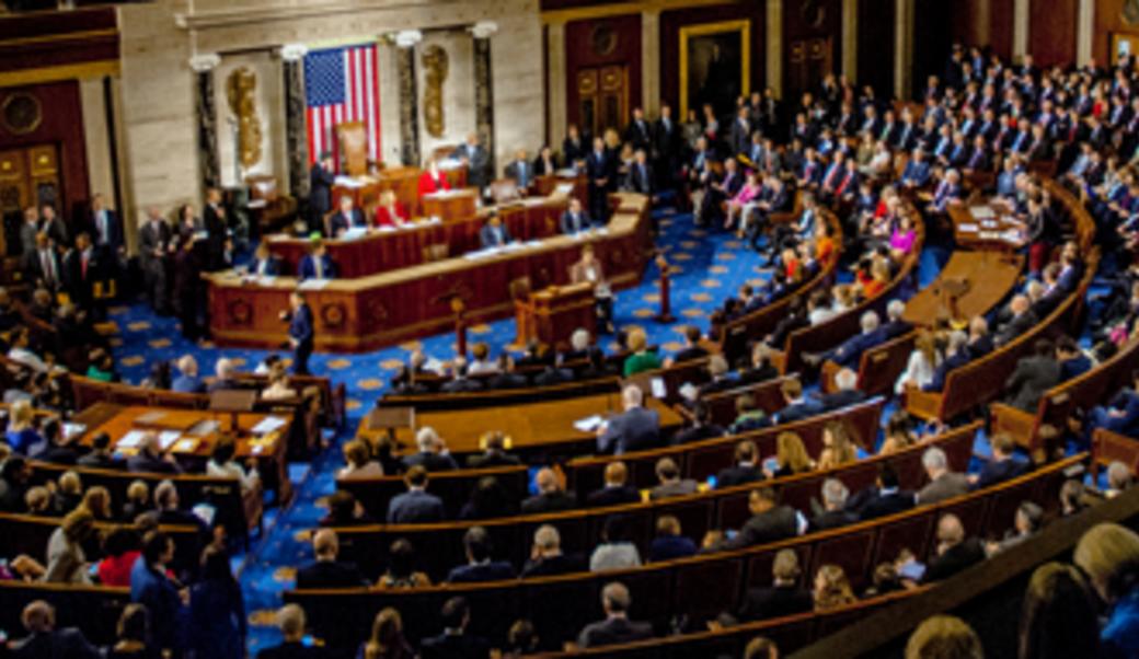 Members of the 115th Congress mingle on the House floor on January 3, 2017, the opening day of the new session.