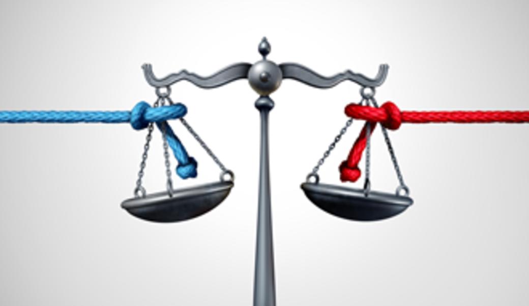 Scales with red and blue ropes pulling in opposite directions