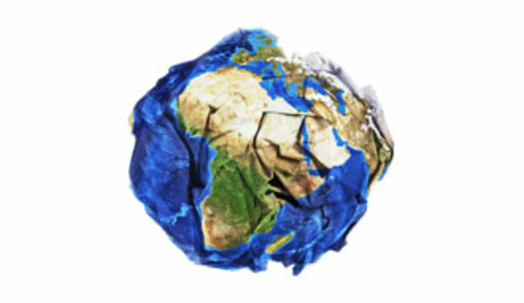 Crumpled up globe like crumpled up paper ball