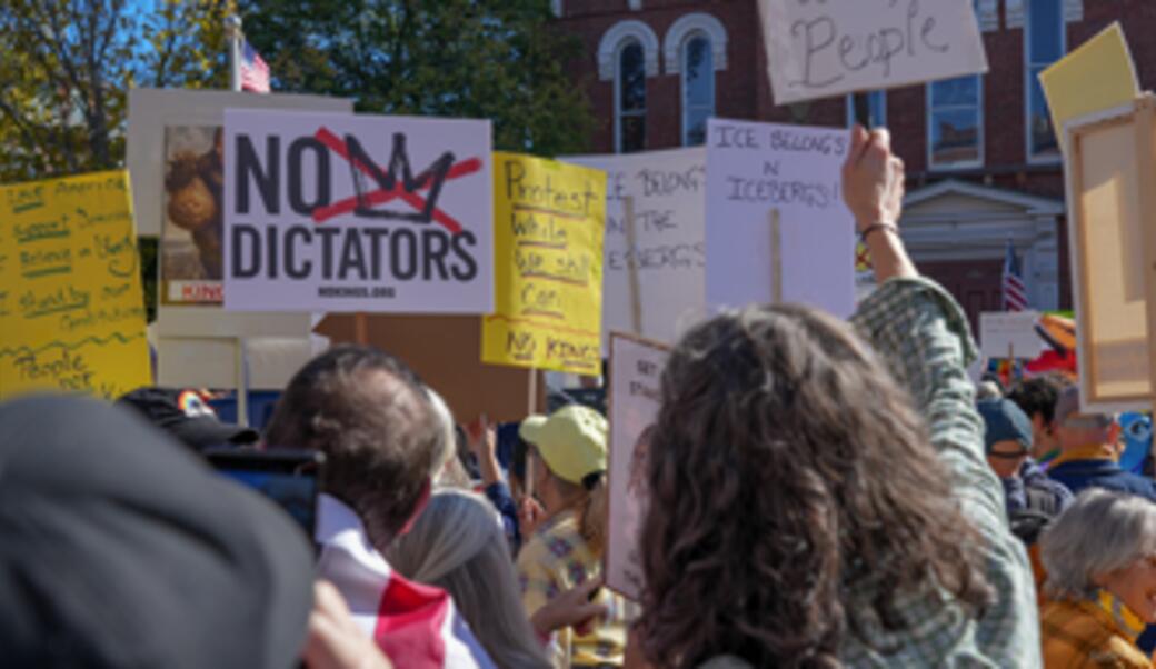 People gathered together to protest during an anti-Trump No Kings protest