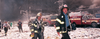New York City firefighters walk near Ground Zero after the collapse of the Twin Towers on September 11, 2001.